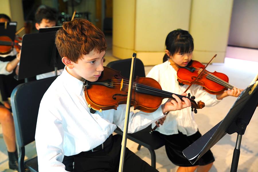 Usdan Summer Camp for the Arts Junior & Orchestra Band Majors perform on stage at the McKinley Amphitheater