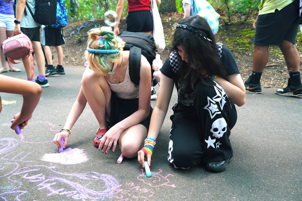 Usdan Summer Camp for the Arts students write in chalk