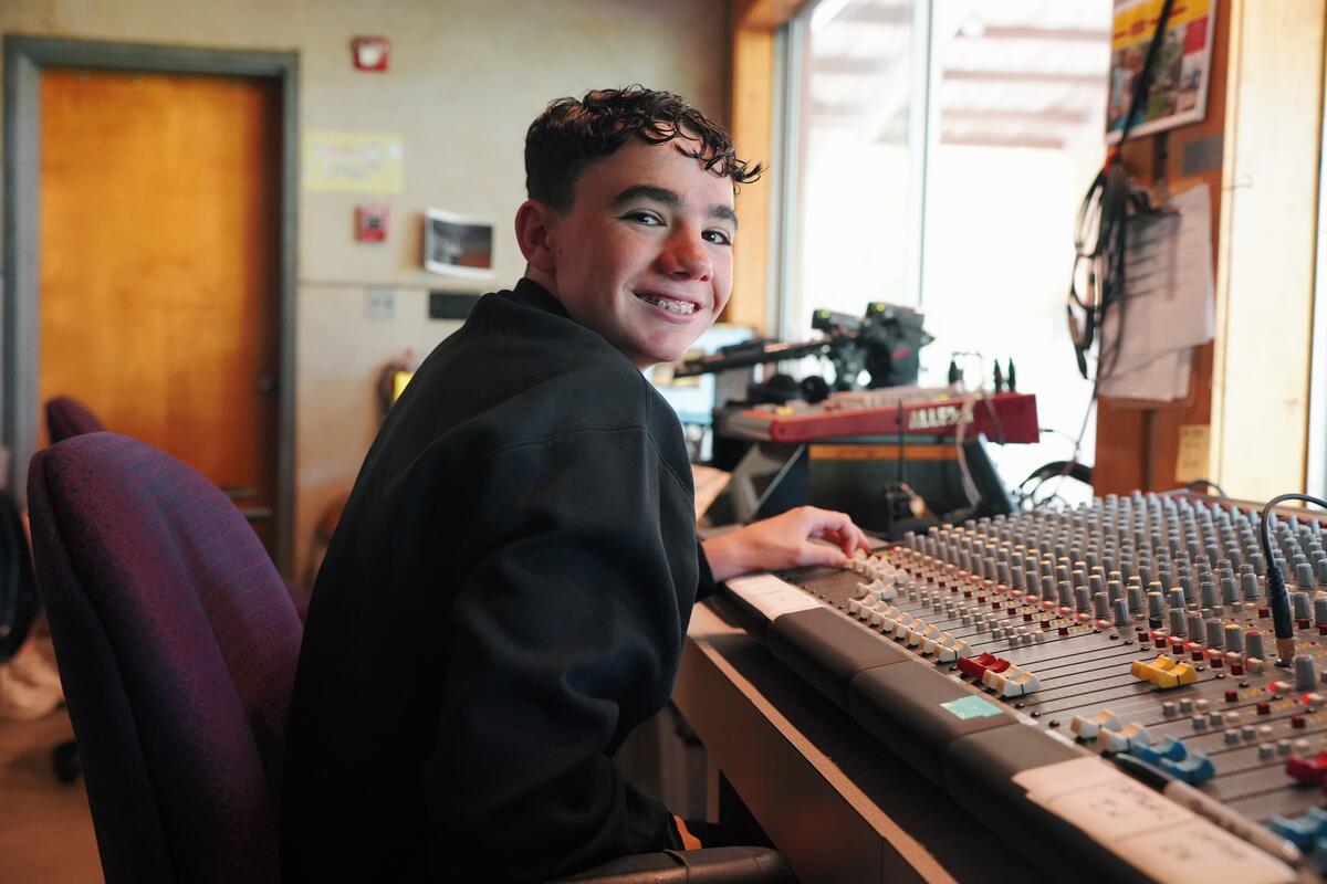 Usdan Summer Camp for the Arts student Matthew R in the McKinley Amphitheater booth