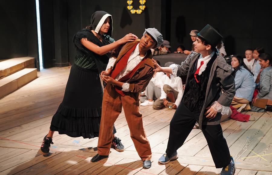 Usdan Summer Camp for the Arts Theater students perform onstage in Oliver!