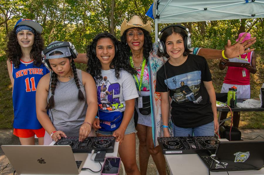 Usdan Summer Camp for the Arts students and Cindy Campbell at the Hip-Hop Pool Party. Photo by Martha Cooper.
