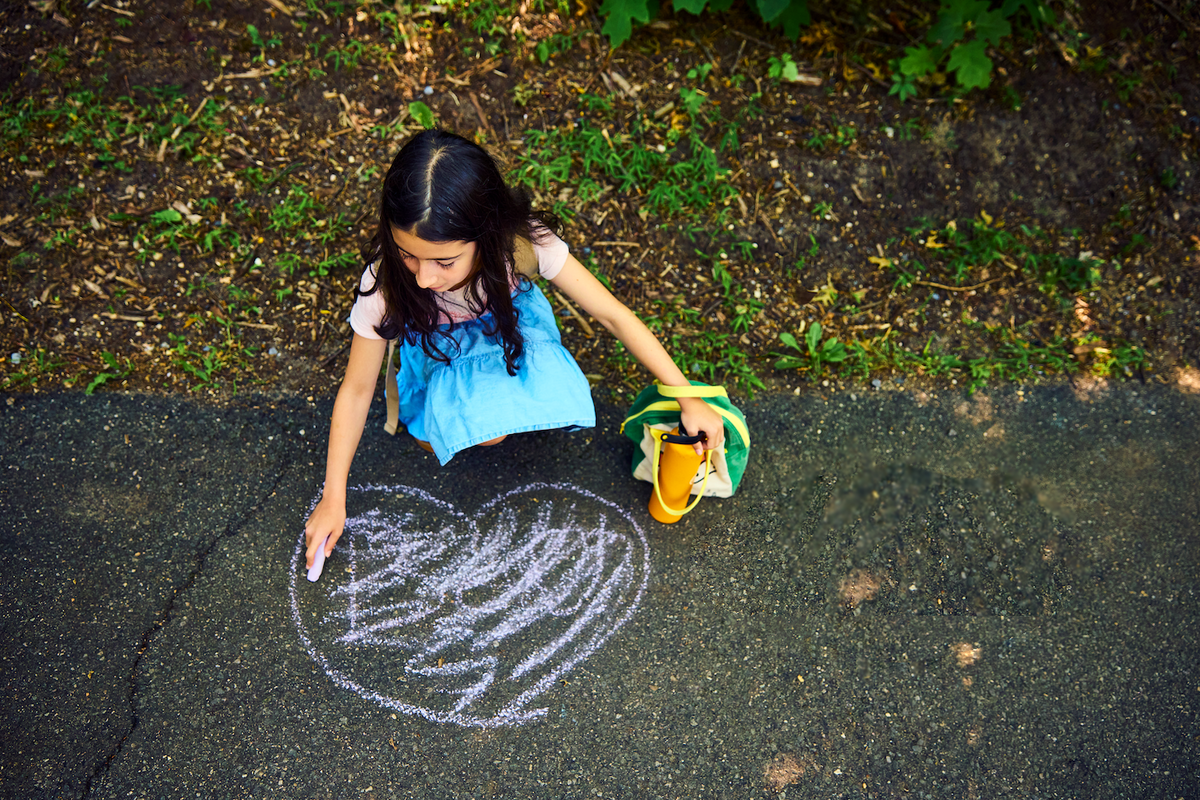 Usdan Summer Camp for the Arts student draws with chalk