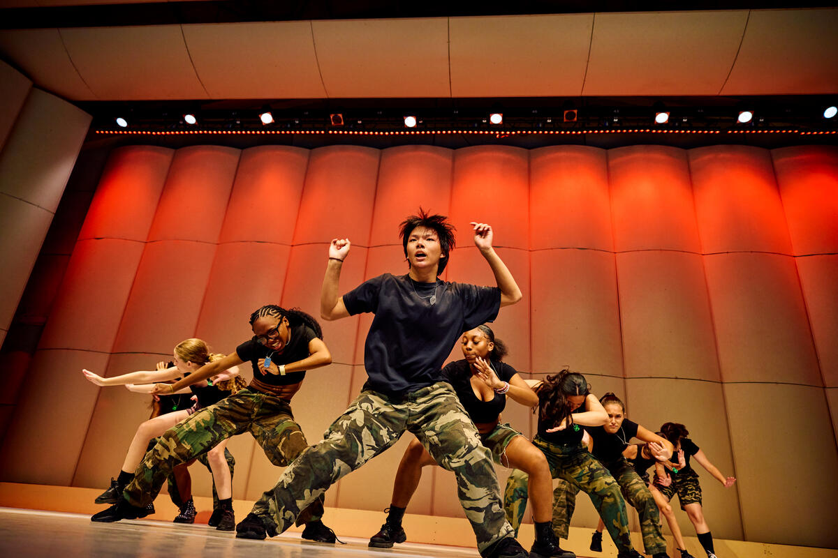 Student dancer performs on stage at Usdan Summer Camp for the Arts