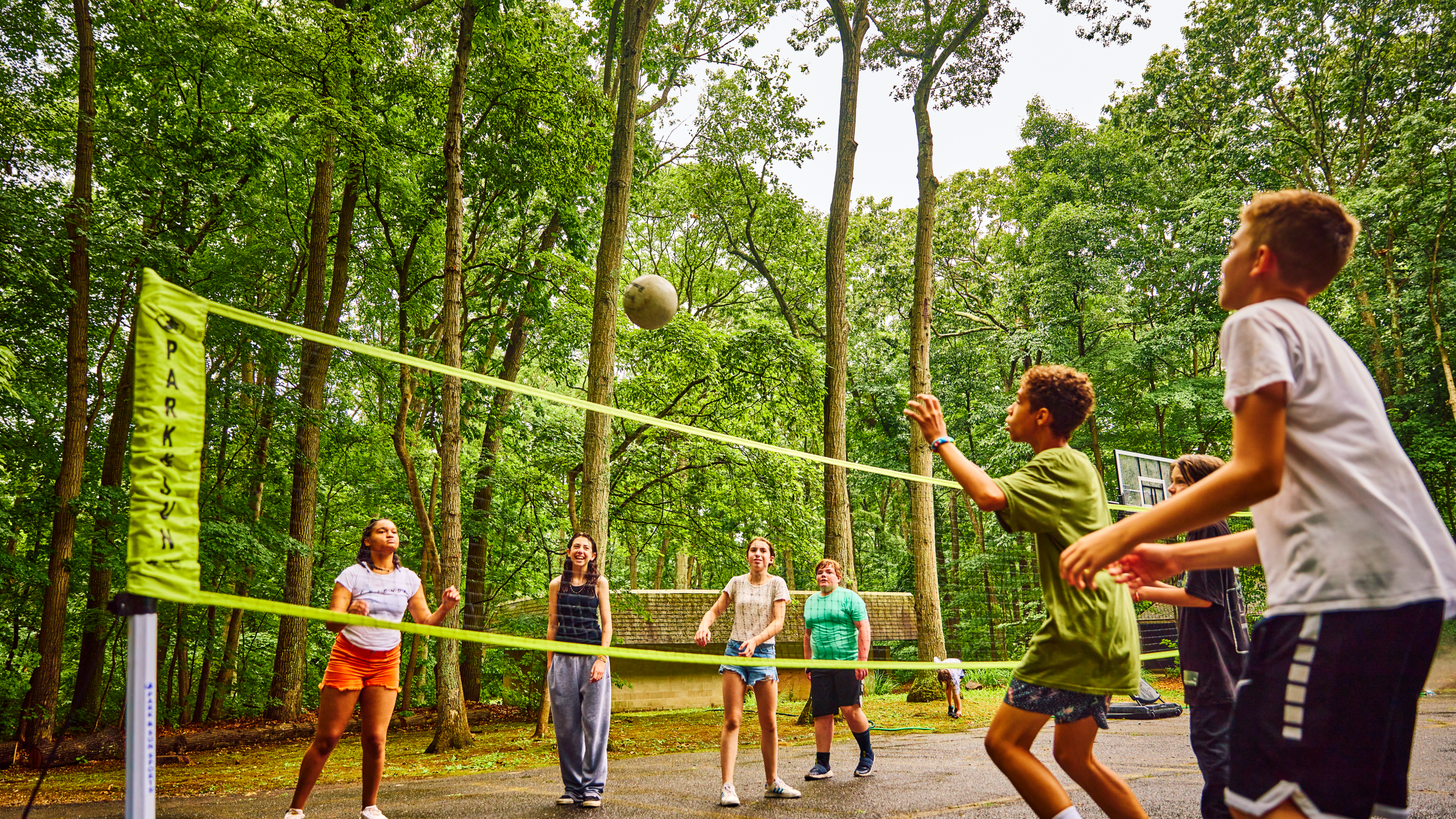 Campers playing volleyball