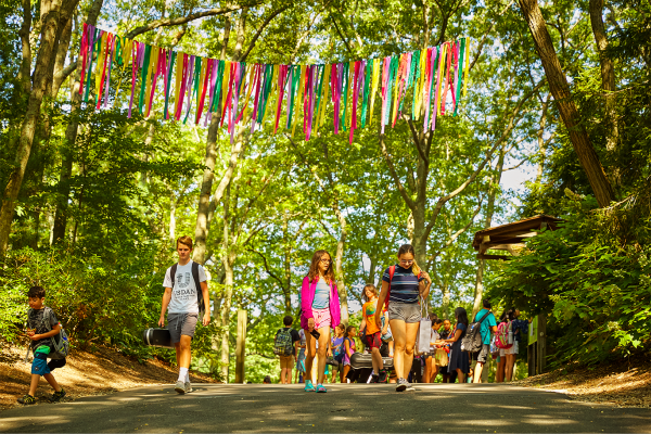 Kids walking through the entrance of our summer arts camp