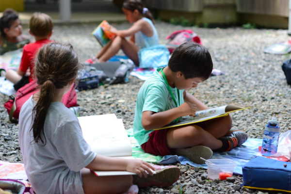 students study on the gravel outside