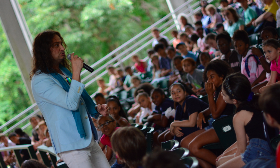 Maroulis performing for students