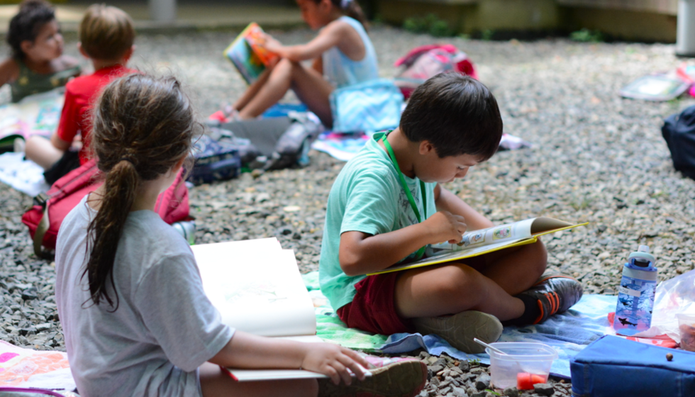 students study on the gravel outside