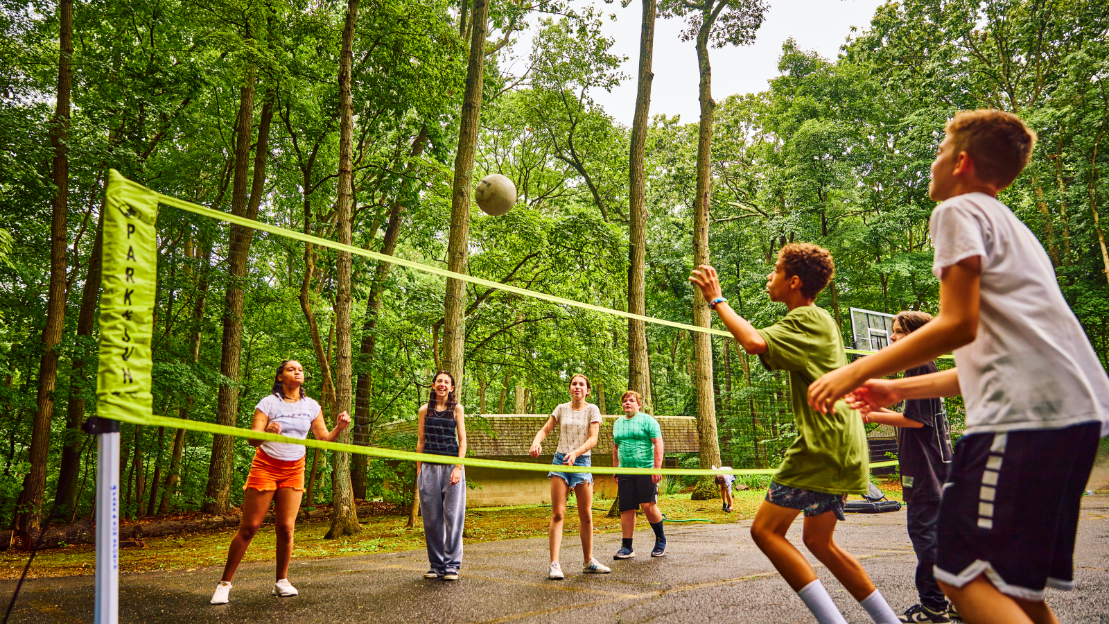 Campers playing volleyball