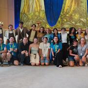 Alum pose with current students after their performance of "Into the Woods."