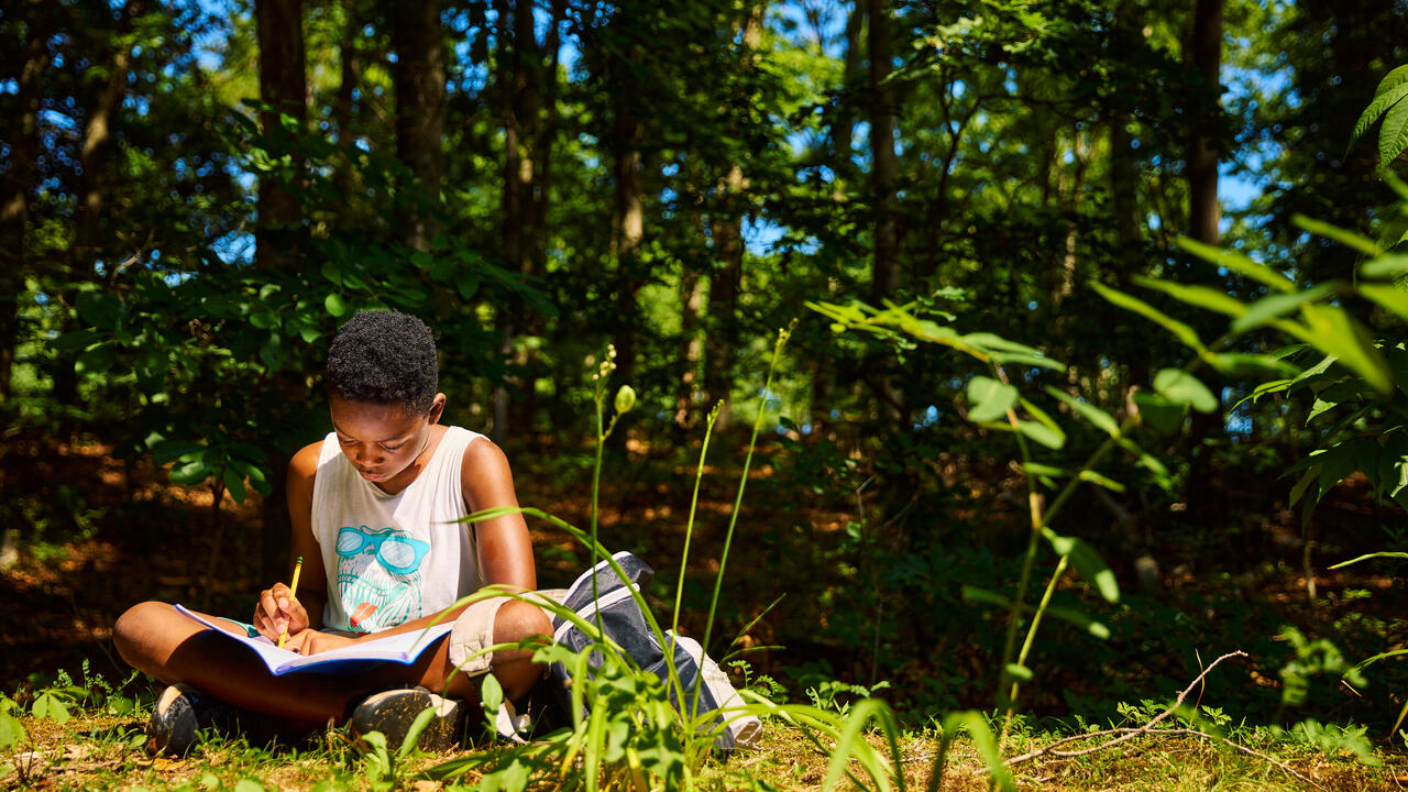 Usdan Summer Camp for the Arts creative writing students write outside