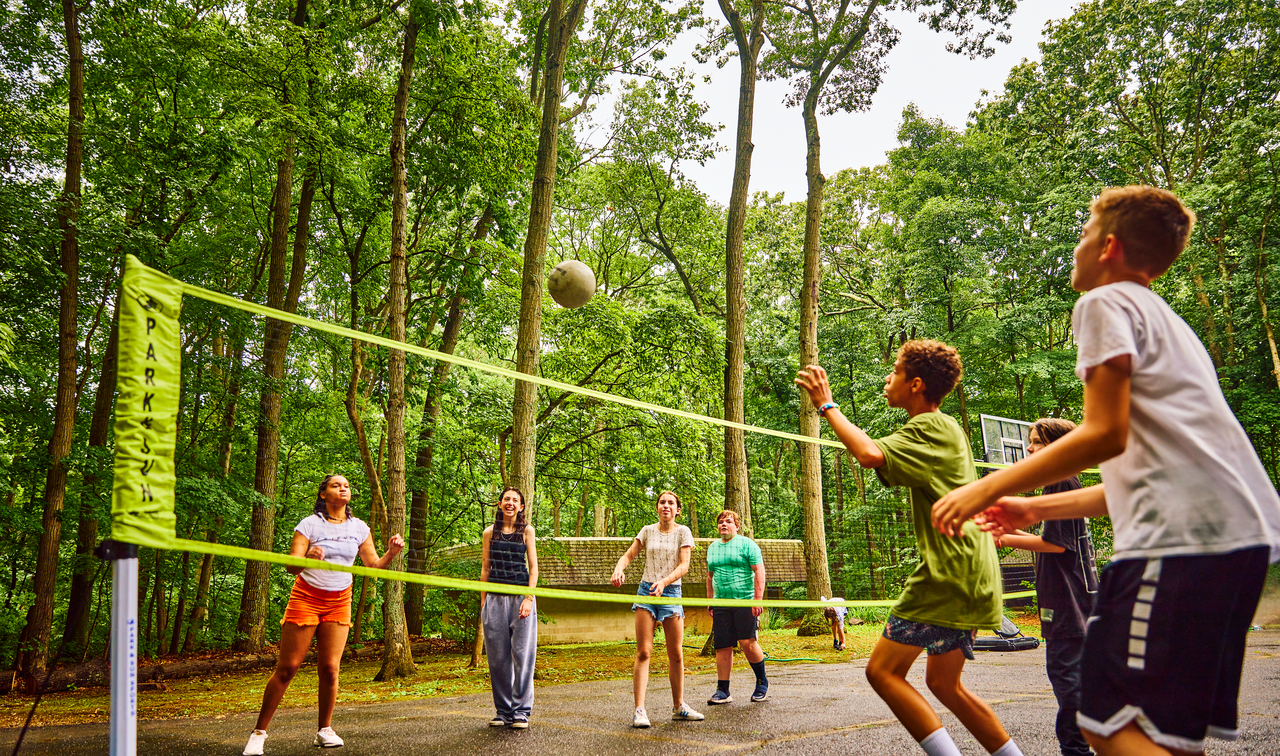 Campers playing volleyball