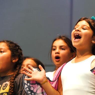 Usdan Summer Camp for the Arts students perform on stage in the McKinley Amphitheater