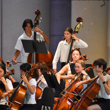Image of middle school students playing in an orchestra