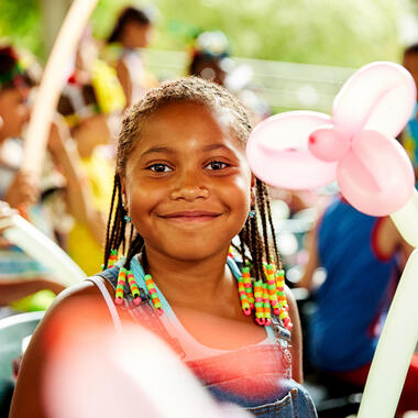 Uniquely U scholarship search Young girl smiling at camera in Amphitheater
