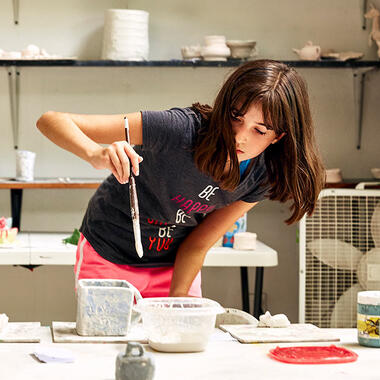 second annual Uniquely U Scholarship Search usdan student paints pottery